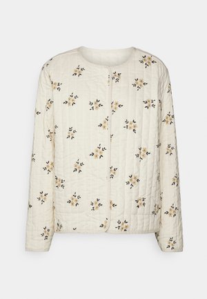 Prošívaná bunda z krémové tkaniny s květinovou výšivkou v žluté a černé barvě. Má dlouhé rukávy a kulatý výstřih. Zapínání na zip.