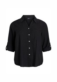 Camisa de lino negra con cuello, bolsillo delantero y mangas enrolladas. Seis botones blancos decoran el frente para el cierre.