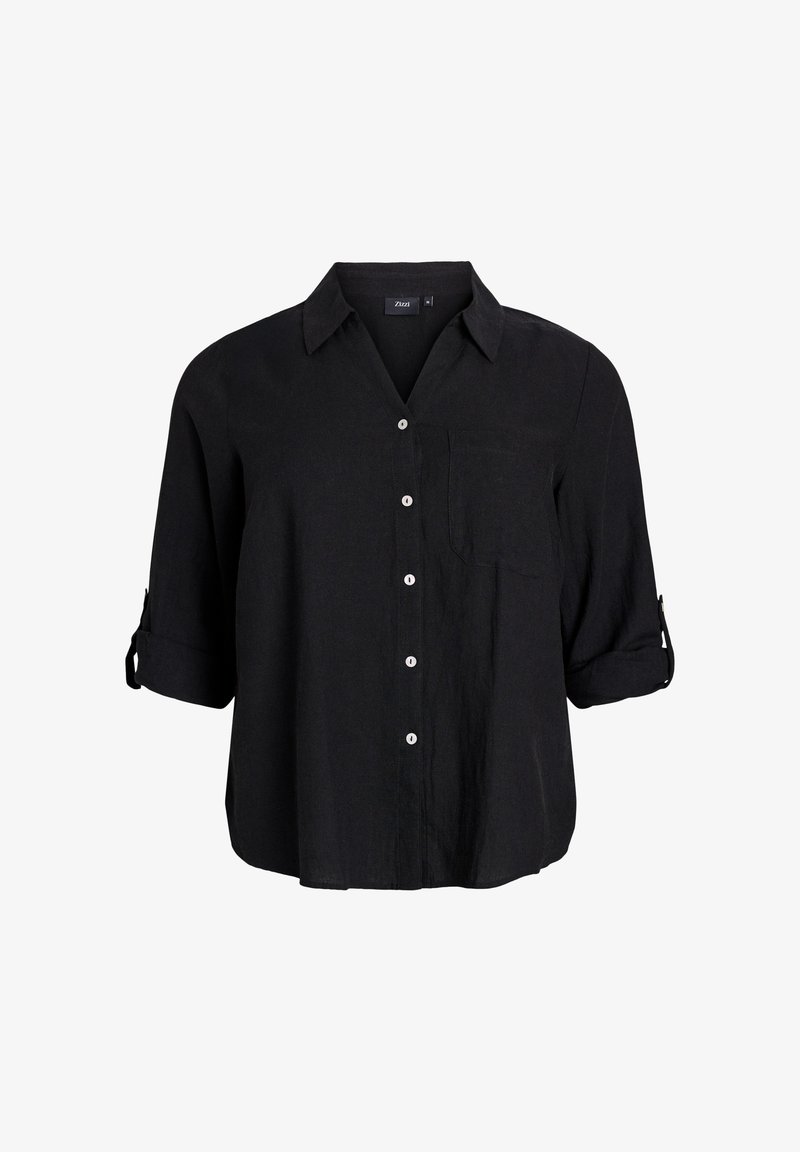 Schwarzes Leinenhemd mit Kragen, Brusttasche und hochgerollten Ärmeln. Sechs weiße Knöpfe schließen die Vorderseite.