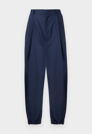 Navy pinstripe trousers featuring a pleated front, elasticized cuffs, and tailored waist. Made from smooth, lightweight fabric.