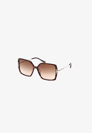 Schildpatt-farbene quadratische Sonnenbrille mit braunen Verlaufsgläsern, goldenen Metallelementen und schlanken Bügeln. Sie zeichnet sich durch ein gewagtes geometrisches Design aus.