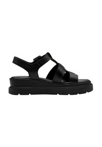 Sandale en cuir noir à bout ouvert avec semelle épaisse, trois brides avant, et bride ajustable à la cheville avec boucle sur fond blanc.