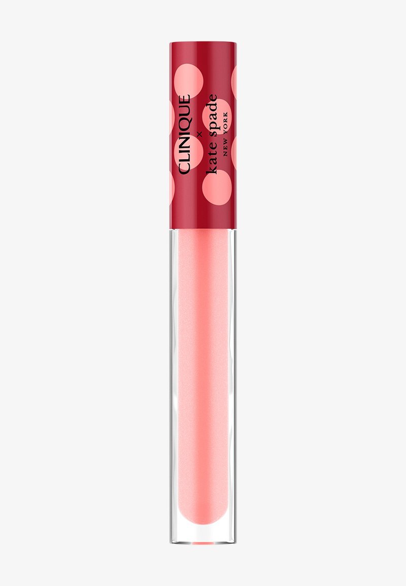 Lipgloss in een doorzichtige tube met een lichtroze tint, voorzien van een rode dop met grote roze stippen en merktekst.