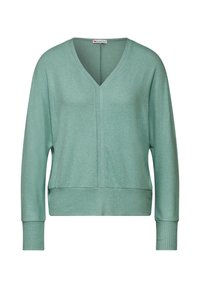 Pull en mint vert avec un col en V, des poignets et un ourlet côtelés. Texture douce, coupe décontractée et détails de couture subtils sur le devant.