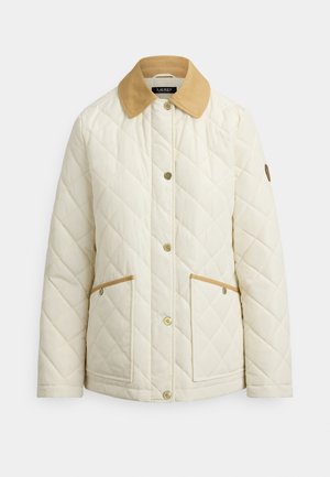 Veste crème matelassée avec un col beige, dotée de boutons-pression et de deux poches avant avec des accents beiges. Coupe droite classique.