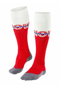 Rote kniehohe Socken mit einem weißen oberen Rand, auf dem das Wort "JETZT" in Rot und Blau steht, graue verstärkte Zehen und Fersen, aus einem weichen Materialmix.