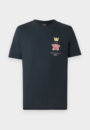 T-shirt en coton bleu marine à manches courtes, avec un imprimé de couronne, de rose et de logo sur la gauche de la poitrine. Encolure ronde simple.