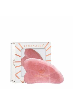 Rozenkwarts gua sha-tool in hartvorm, met een gladde textuur. Geleverd met een vierkant witte verpakking met gouden accenten en branding.