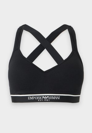 Sort sports-bh med krydsede stropper bagpå og hvid Emporio Armani logo-bånd nederst mod en lys baggrund.