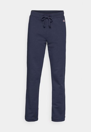 Marineblå joggebukser laget av myk bomullsblanding, med snøring i midjen og lukket hem, og et lite logodesign.
