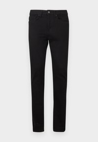 Vaqueros negros hechos de tela de algodón, con un ajuste ceñido, cinco bolsillos, cierre frontal con botones y un sutil desgaste en la tela.