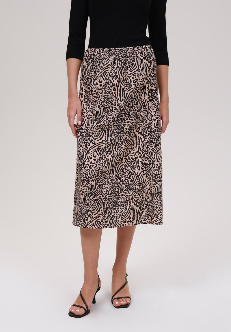 Jupe midi en tissu léger, avec une base rose ornée de motifs animaliers noirs. Coupe droite avec une taille élastique.