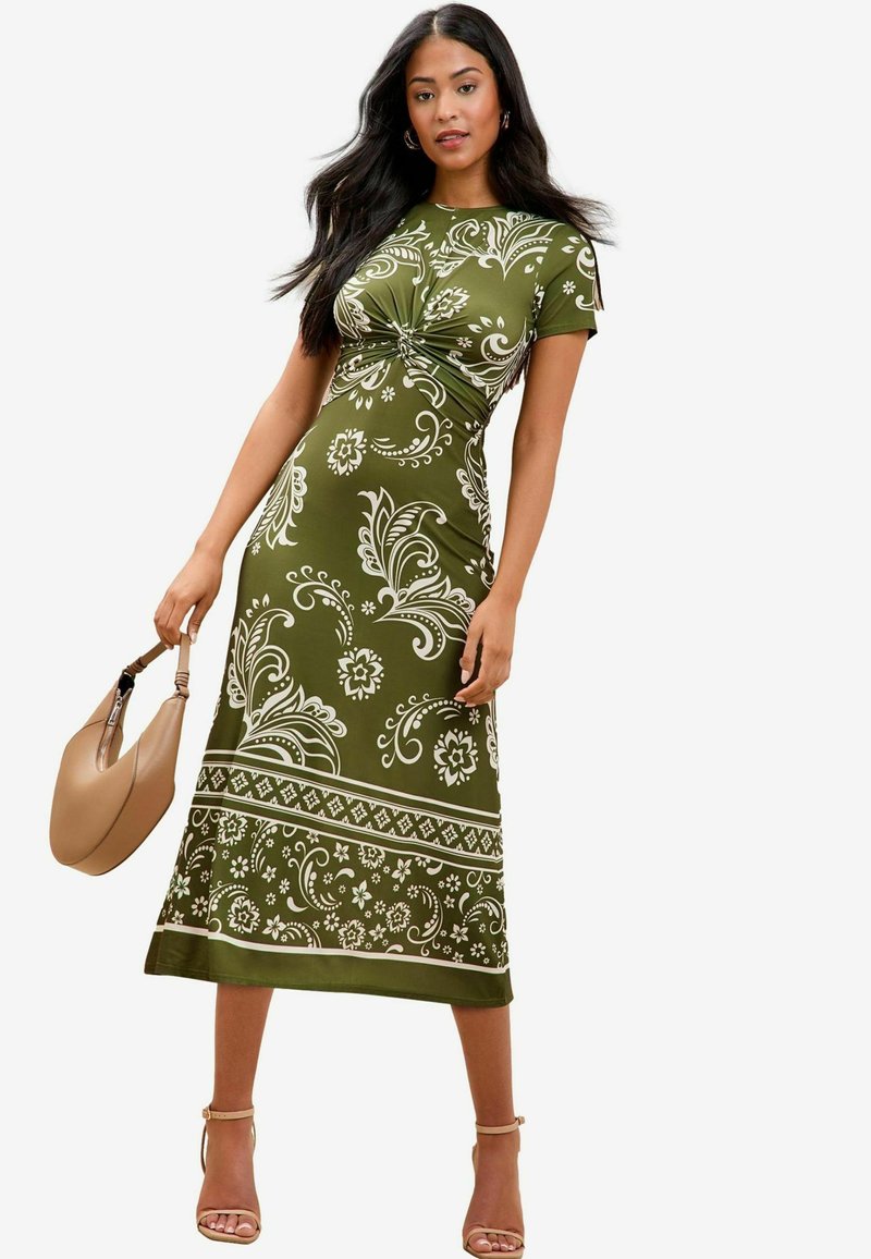 Rochie verde măslinie cu modele florale și geometrice albe, detaliu legat la talie, mâneci scurte și tiv drept.