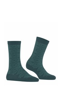 Ciemnozielone skarpetki z wzorem liści, wykonane z miękkiego materiału, z żebrowanymi ściągaczami i o średniej wysokości.