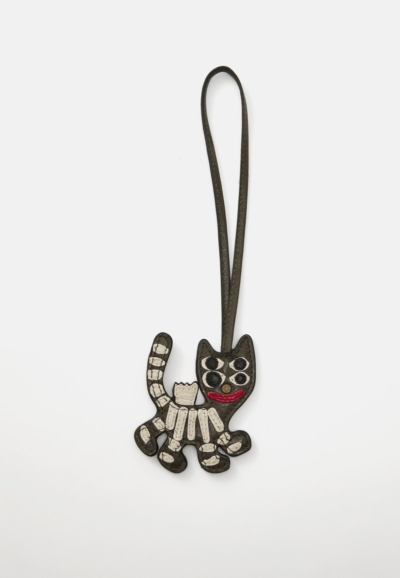 Black and white leather cat-shaped keychain featuring a patterned body, round eyes, a red mouth, and a hanging loop.