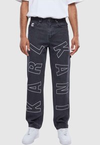Karl Kani OG GY WOREAR LOGO PRINT DENIM - Traperice ravnih nogavica - bleached black