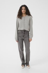 Light gray cotton cardigan with button closure, worn over high-waisted black jeans. Model wears pointed white heels. Simple, relaxed fit.