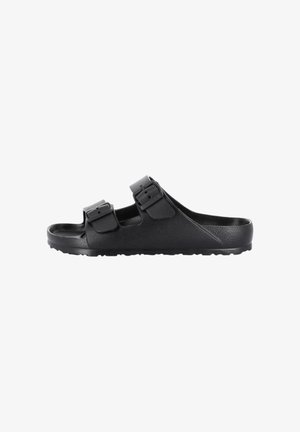 Sandalo nero slip-on con due cinturini regolabili con fibbia e suola texturizzata, mostrato di lato su sfondo bianco.