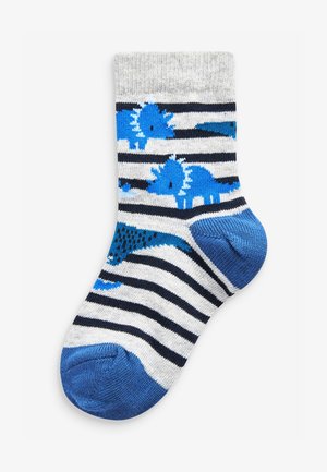 Calze blu con motivo di dinosauri, decorate con strisce grigie e blu navy. Realizzate in un materiale morbido, con punta e tallone di un blu uniforme.