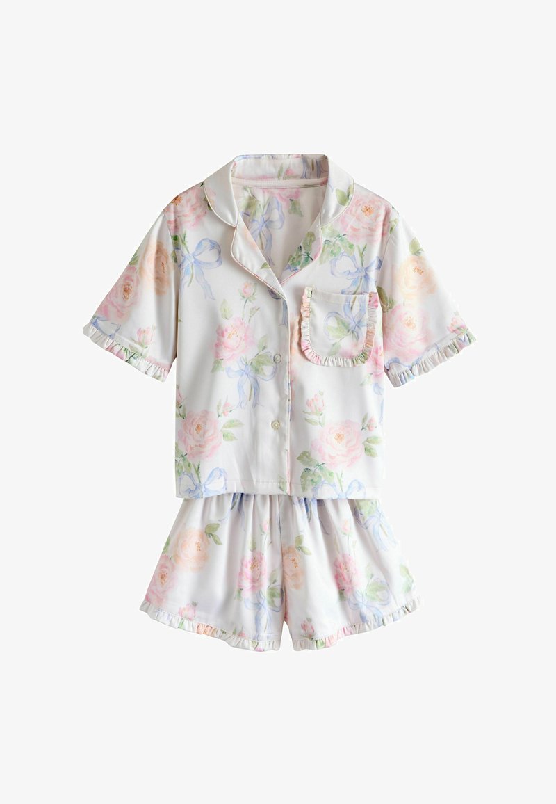 Haut de pyjama boutonné à manches courtes et short assorti avec motifs floraux pastel et nœuds, présentant des bords froncés sur les manches, la poche et le short.