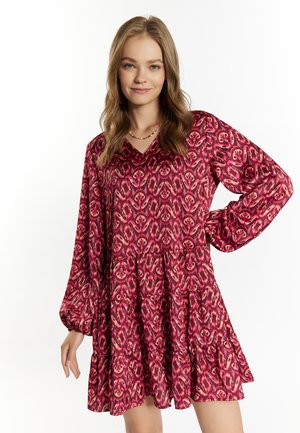 Braun gemustertes Kleid mit V-Ausschnitt, langen Ärmeln und gestuftem Rock. Besitzt ein blumenartiges Design und leichten Stoff.