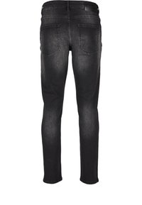 Jean noir slim avec deux poches arrière et un léger effet délavé sur les cuisses et les genoux, vu de dos.