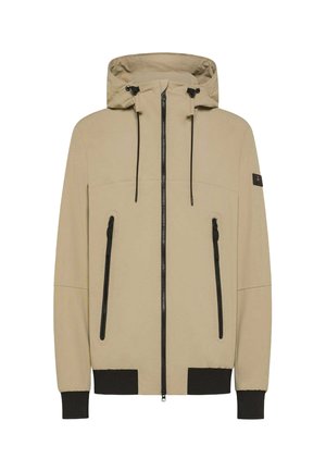 Giacca cappuccio beige con zip nere. Presenta due tasche frontali, polsini elastici e una texture solida e liscia. Design minimalista.