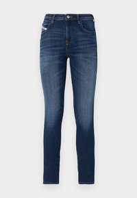 Jeans ajustados en denim azul oscuro con un sutil desgastado. Presentan un diseño clásico de cinco bolsillos y un cierre de botón metálico.
