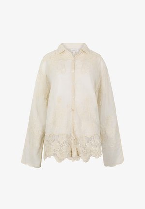 Blouse crème à manches longues avec boutons, broderie florale en dentelle et ourlet festonné.