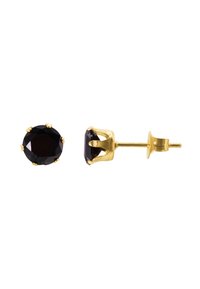 Boucles d'oreilles clous en forme d'ovale noire, dotées d'un sertissage en ton doré et d'un fermoir à tige pour un maintien sécurisé. Texture lisse et finition brillante.