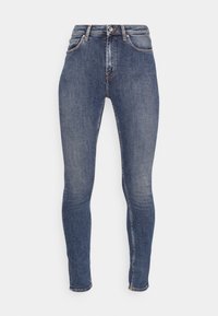 Tajta jeans i mörkblå denim med en åtsittande design, fem fickor och klassiska sömmar. Dragkedja med knappstängning.