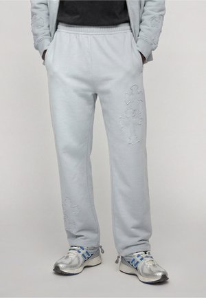 FAVELA CROSS PATCHES JOGGER - Trainingsbroek - light blue