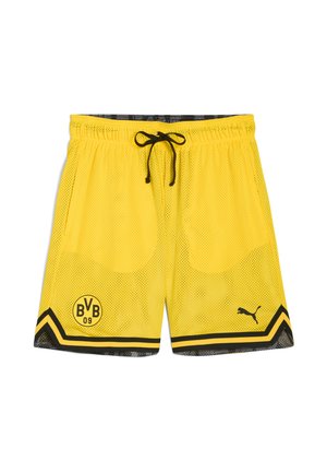 Gule mesh sportsshorts med sorte detaljer, der har en snøre i taljen, holdets logo og et diagonalt stribe mønster ved kanten.