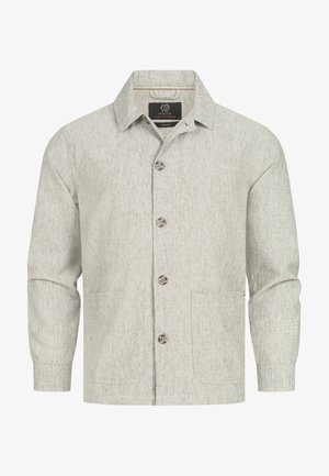 Lys grå skjorte med knaplukning, lavet af struktureret stof. Har en spids krave og to forlommer. Knaplukning med fire knapper.