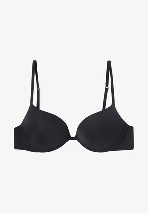 Černá podprsenka s vyztuženými košíčky, nastavitelnými ramínky a hladkým povrchem. Obsahuje kosticemi a zapínání na háček a oko na zadní straně.