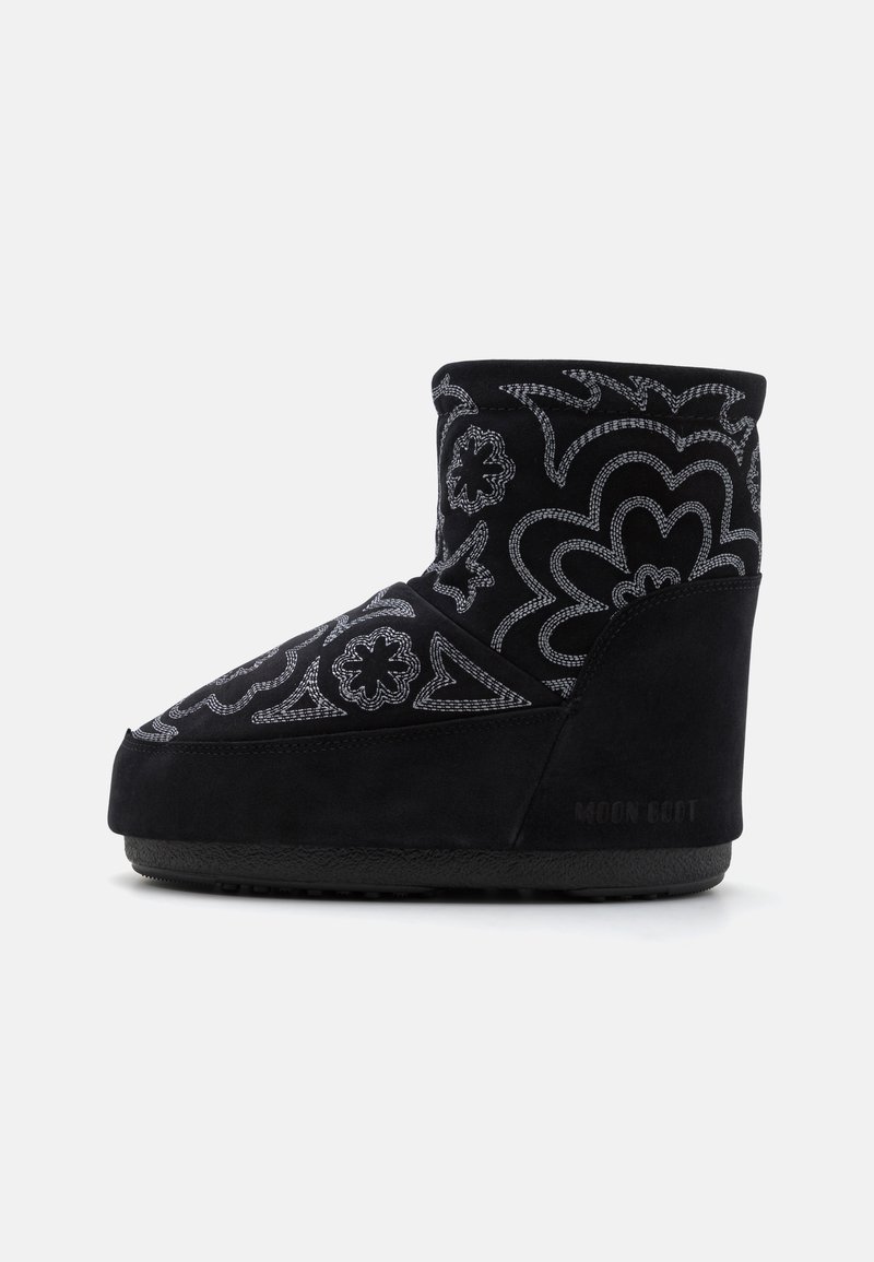 Black suede ankle boot with white floral embroidery, wedge heel, textured sole, and logo detail on the back. Rounded toe design.