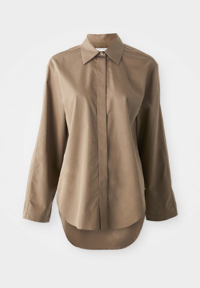 Brown long-sleeve shirt made of smooth fabric, featuring a pointed collar, front button closure, and a rounded hem at the back.
