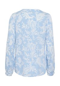 Light blue long-sleeve shirt featuring a white paisley pattern. Soft fabric with a loose fit, rounded neckline, and buttoned cuffs.