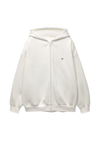 Sweat à capuche blanc zippé intégral avec un petit logo foncé sur la poitrine gauche, poignets et ourlet côtelés, et une capuche fixée.