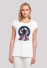 White cotton t-shirt featuring a graphic design of The Who with a circular motif in blue and red, incorporating a Union Jack pattern.