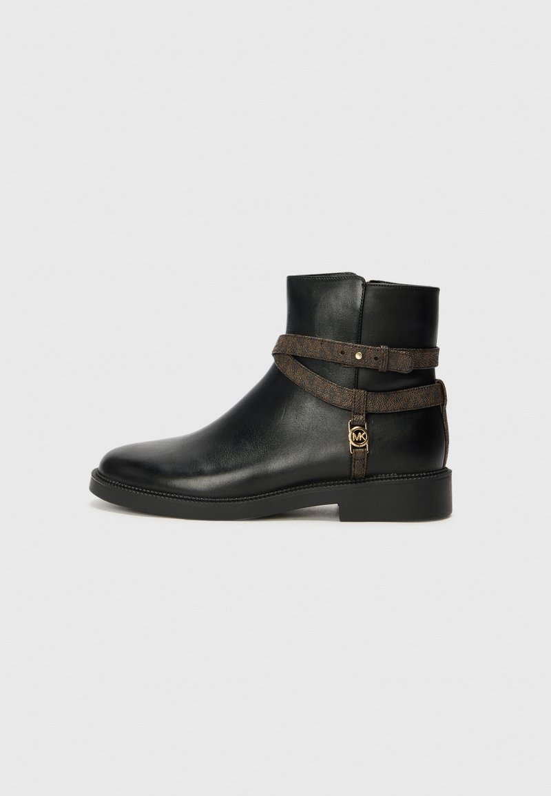 Black leather ankle boot with a flat sole, featuring a brown patterned strap and gold-tone hardware detail. Smooth texture.