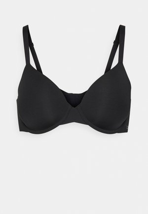 Sort polstret bh med justerbare stropper, sømløst design og en glat tekstur. Har et diskret logo på siden. Velegnet til daglig brug.
