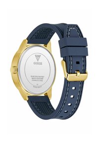 Goldfarbene Edelstahl-Uhr mit einem blauen Silikonkautschukarmband. Verfügt über ein strukturiertes Design, eine Wasserbeständigkeitsbewertung und eine verstellbare Schnalle.