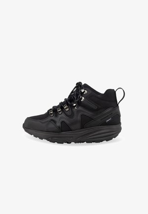 Black high-top sneaker made of textile and rubber, featuring metallic eyelets, a padded collar, textured side accents, and a grooved sole.