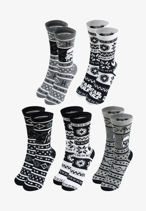 Calzini a righe nere e grigie presentano design a tema Star Wars, tra cui Stormtrooper e Darth Vader, con una texture accogliente e lavorata a maglia.