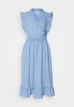 Light blue wrap dress with black polka dots, ruffled sleeves, elastic waist, and a flared hem. Made from a soft, lightweight fabric.