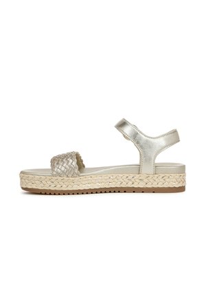 Woven metallic silver sandal with an adjustable ankle strap and a thick, braided jute platform sole. Flat rubber outsole for grip.