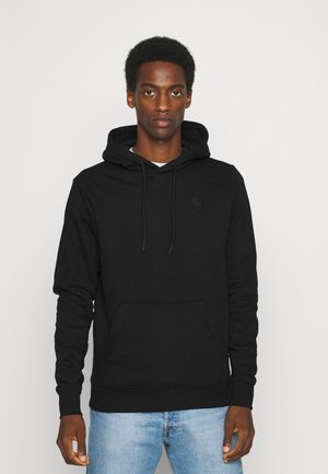 Schwarzer Hoodie aus Baumwolle, mit Kängurutasche, Kapuze mit Kordelzug und gesticktem Logo auf der Brust. Enganliegende Bündchen und Saum.