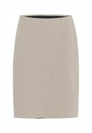 Beige figursydd kjol med en slät yta, med en asymmetrisk inslagning och en svart inre midjeband.