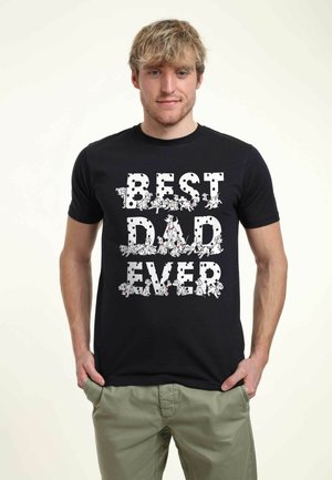 Black t-shirt featuring the text "BEST DAD EVER" in white with a design of Dalmatian puppies integrated into the letters. Short sleeves.